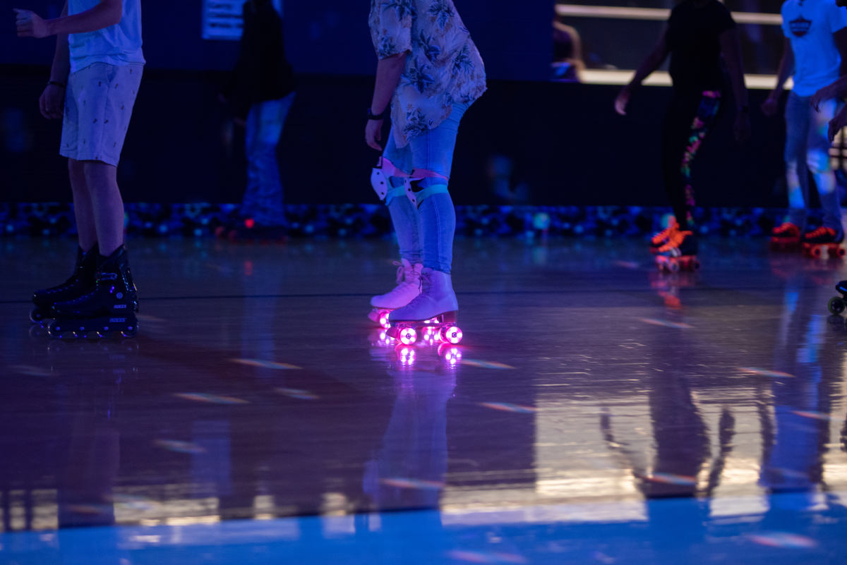 image of woman skating with pink light up wheels