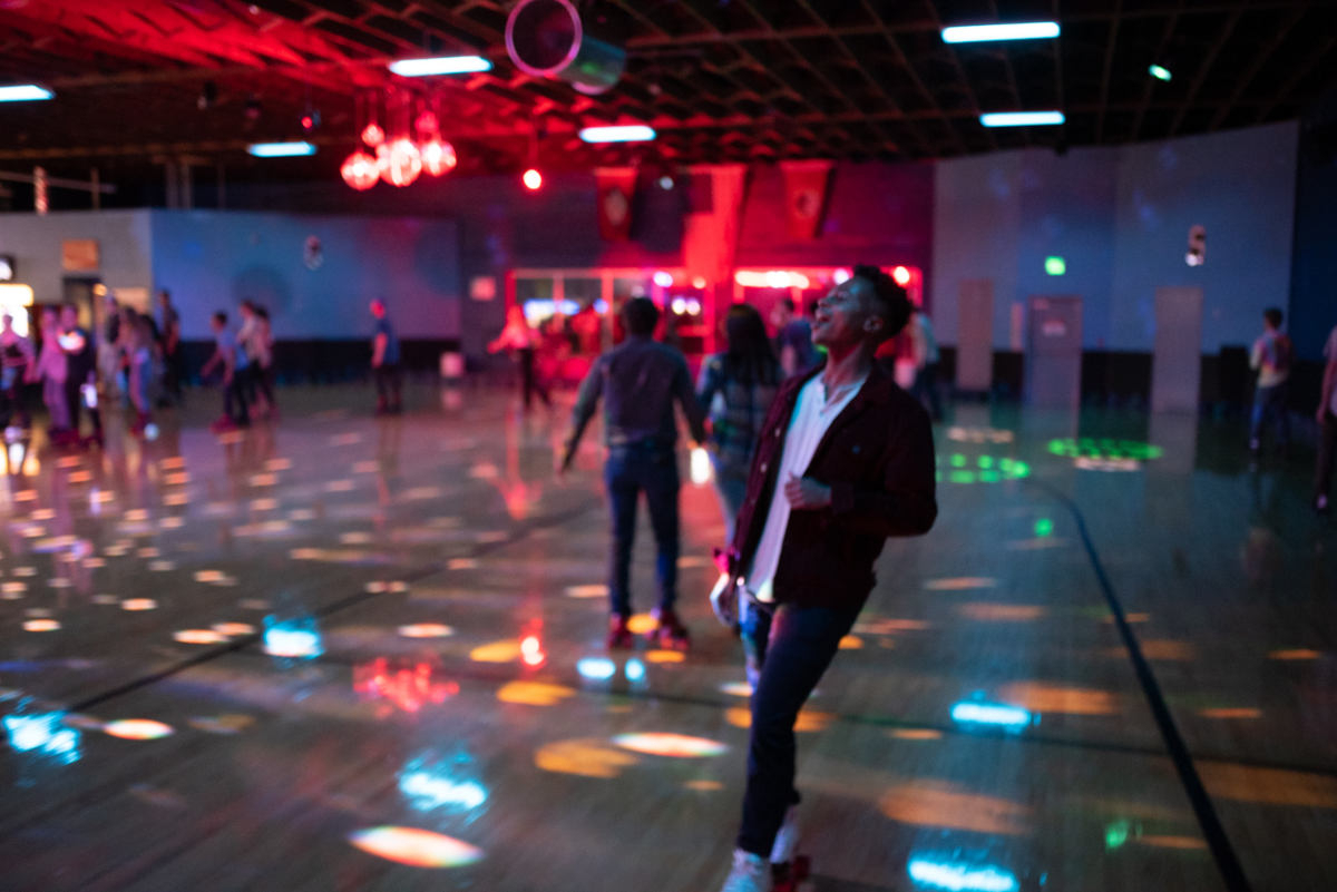 image of young man skating backwards